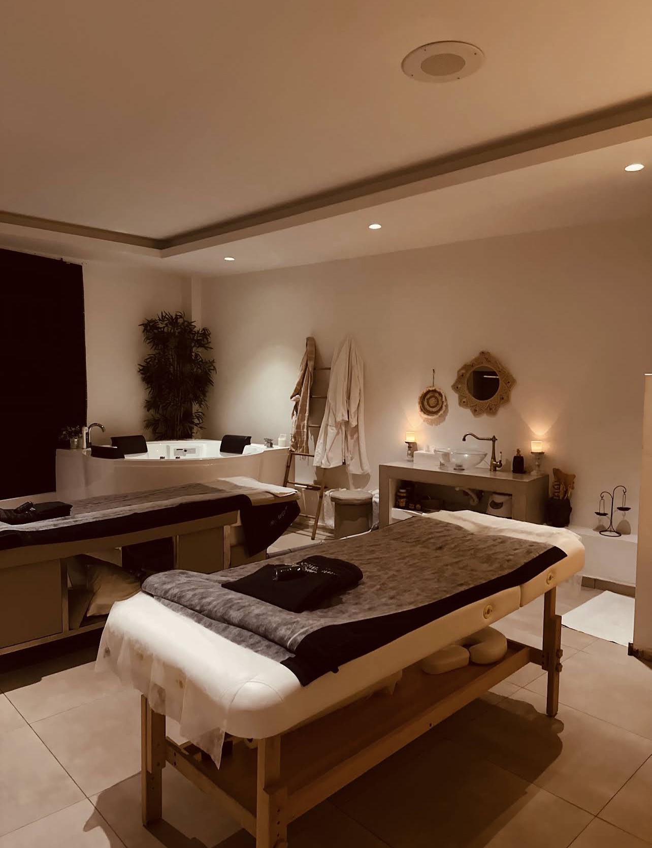 Warm couples massage suite with jacuzzi