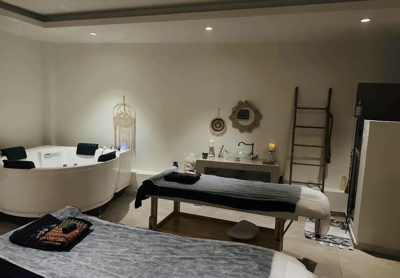 Massage beds and jacuzzi in a private spa room
